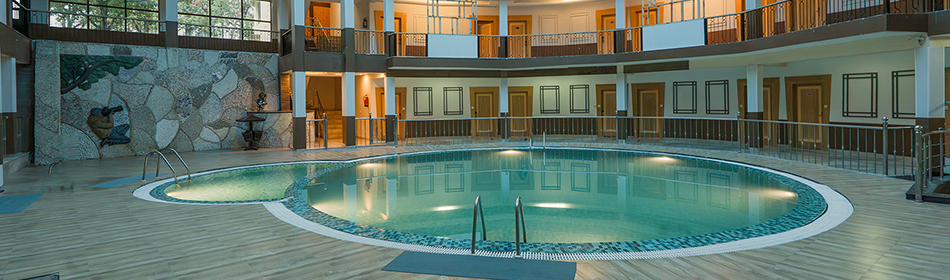 Natural light flooding the atrium pool